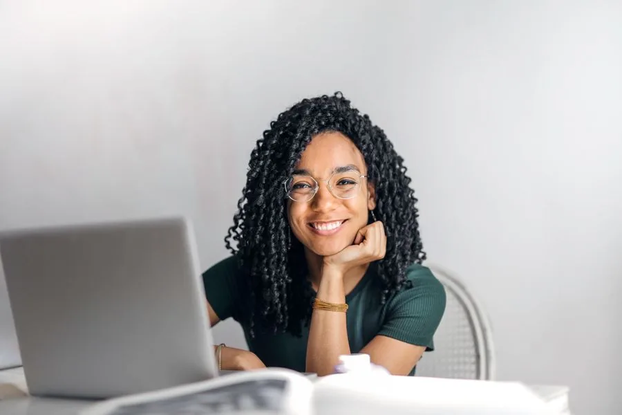 A smiling professional at her desk